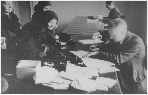Jews obtaining work permits or ID cards in an administrative office in the Krakow